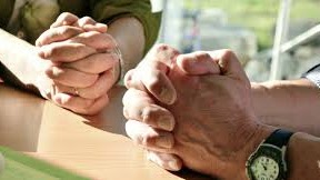 Clasped hands — the one thing we forbid